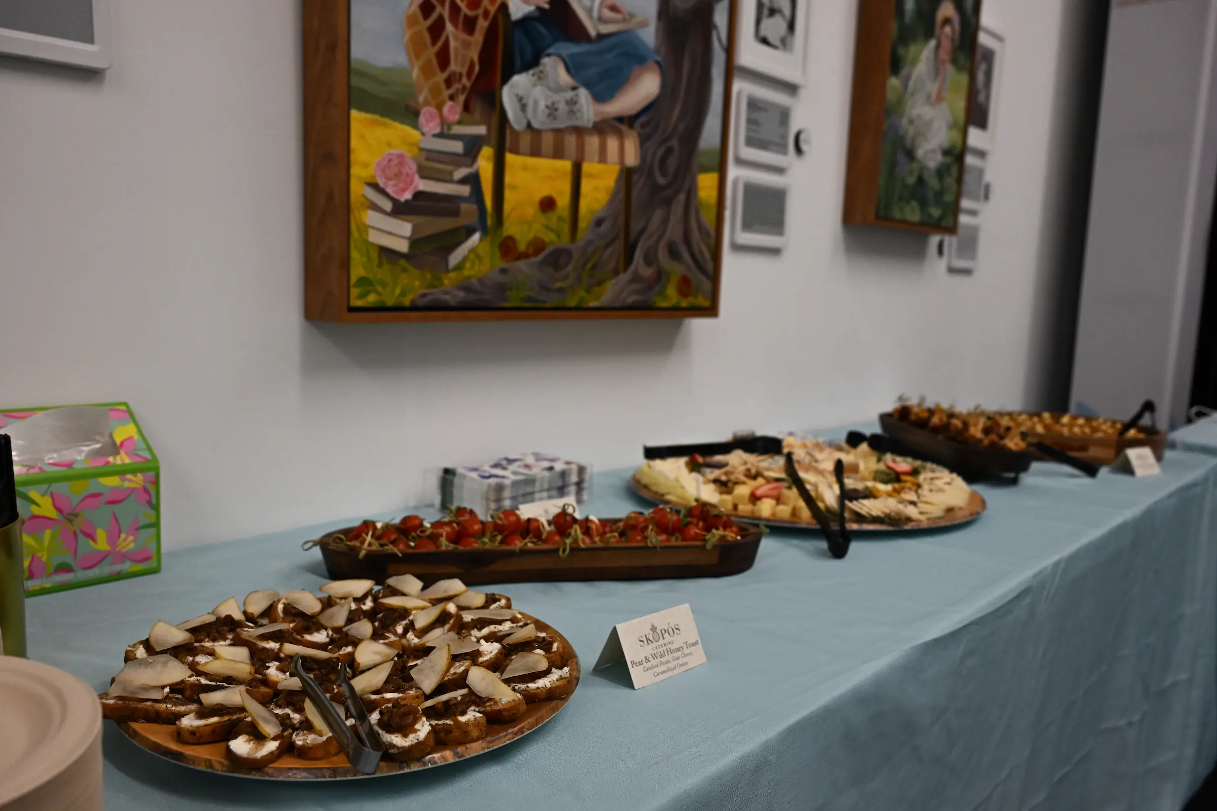 Catered event at LEDI Center with artwork backdrop